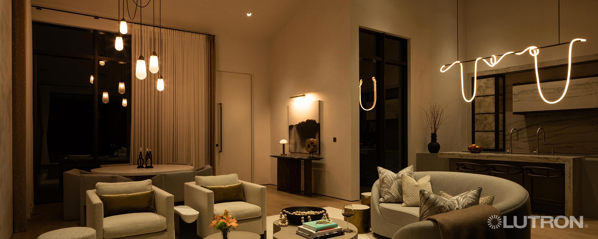 Modern living area with unique hanging lights and warm ambient lighting