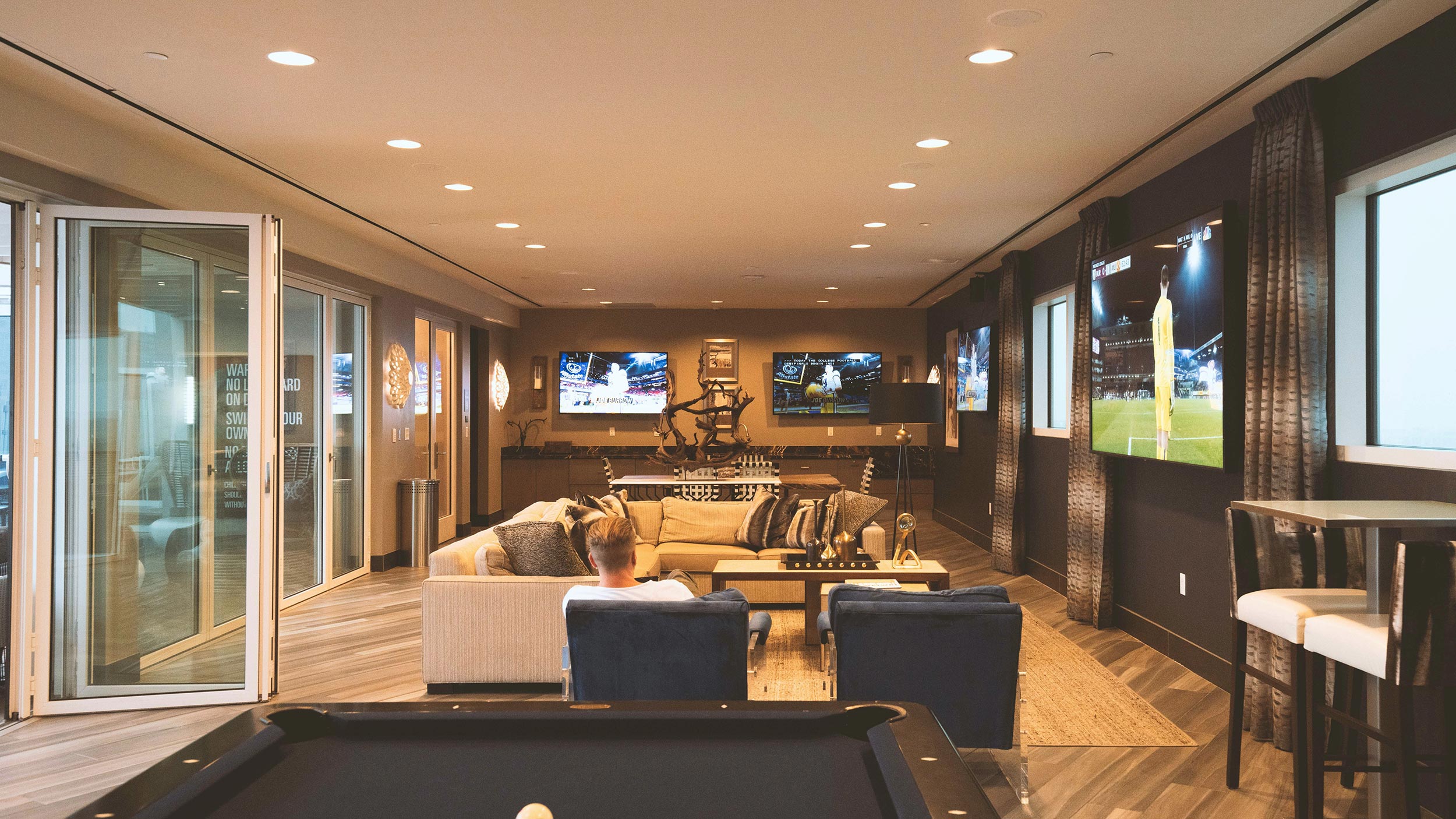 Modern lounge area with stylish furniture and built-in shelving