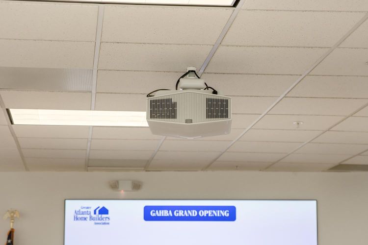 Ceiling-mounted projector in a conference room
