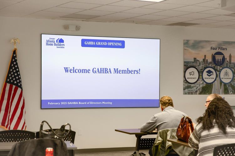 Presentation screen welcoming GAHBA members during a board meeting