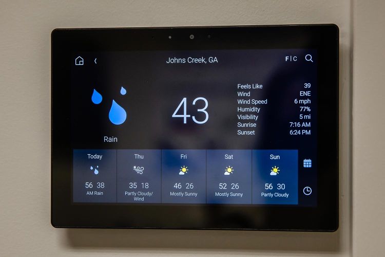 Touch panel showing weather forecast for Johns Creek, GA