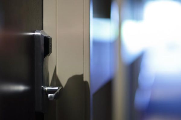 Close-up of an electronic door strike in a hallway
