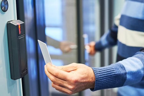 Person using a keycard reader for building access