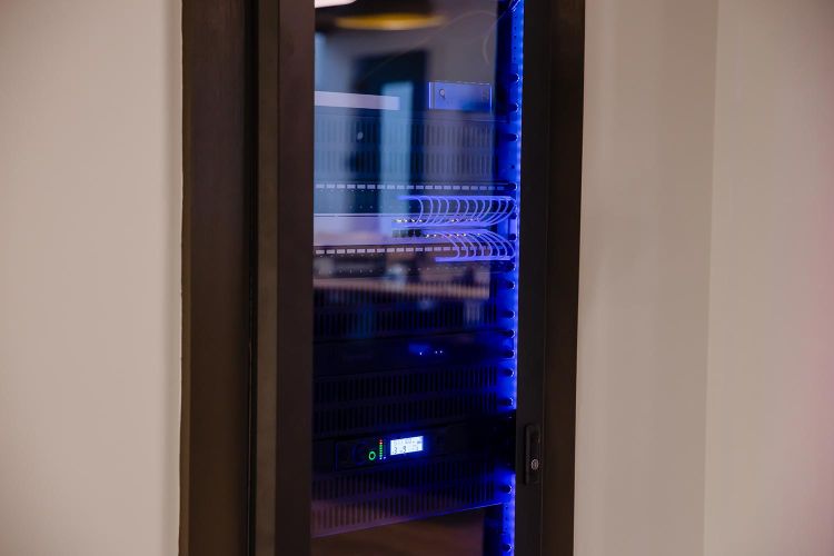 Close-up view of server rack showing network cables and LED indicators