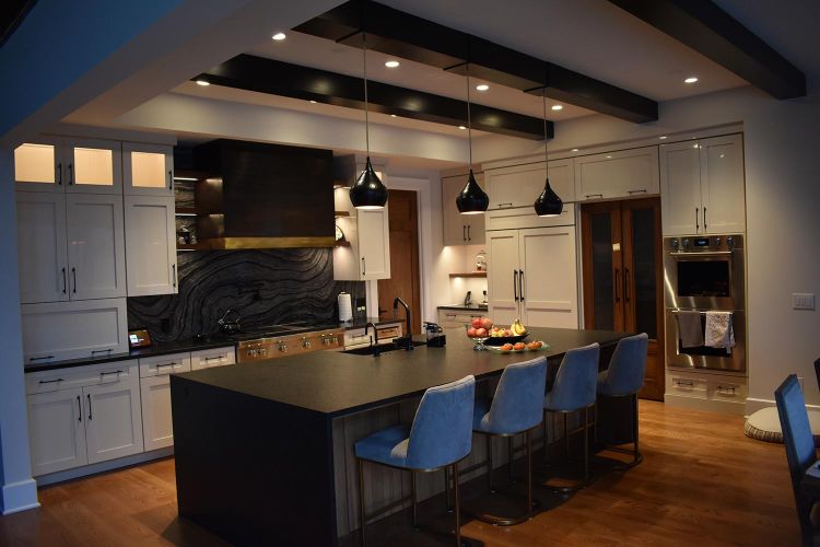 Dimly lit kitchen with soft warm lighting and wood accents